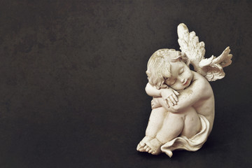 Guardian angel on grunge background with copy space