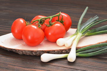 Ripe tomatoes and green onions