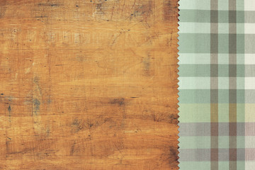 Tablecloth on grunge wooden background