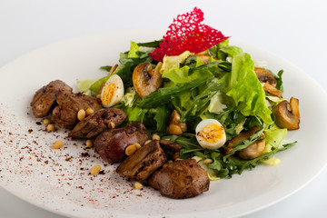 Salad with a liver close-up on a white background