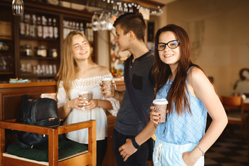 Group of friends enjoying in cafe together.