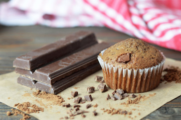 Chocolate muffin and broken pieces of chocolate