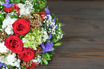 Wedding bouquet on wooden background