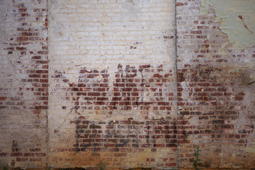 Background of old weathered white and red brick wall 
