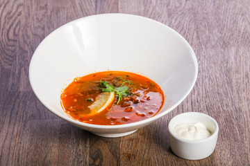 Solyanka soup with lemon