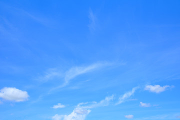 Obraz premium Fluffy white clouds on blue sky.
