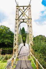 wooden suspension bridge walkway. - obrazy, fototapety, plakaty