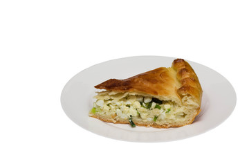 Savory pie with chicken,  onion and egg a white background. Isolate.