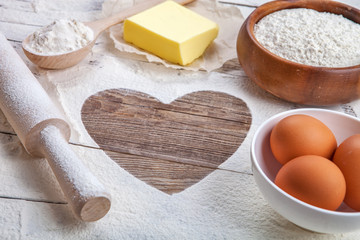 heart of the flour on the board rolling pin