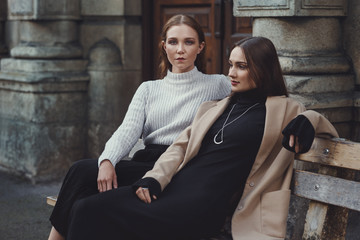 Beautiful elegant caucasian women posing outdoors