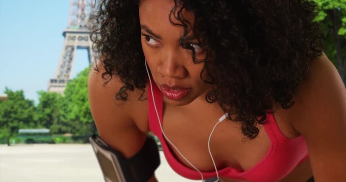 Close Up Of African American Tourist Keeping Fit While On Paris Vacation, Black Woman Runner Catching Her Breath In Front Of The Eiffel Tower In France, 4k