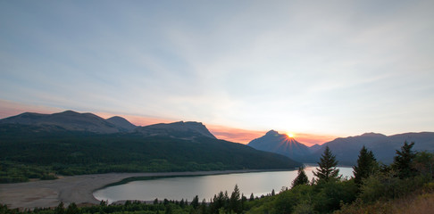 Smokey Sunset over Lower Two Medicine Lake in Glacier National Park in Montana United States duirng...