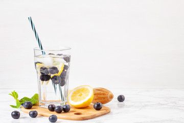 Herbs and fruits flavored infused water. Summer refreshing drink. Health care, fitness, healthy nutrition diet concept.