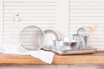 Fototapeta na wymiar Vintage kitchen utensils on the wooden shelf
