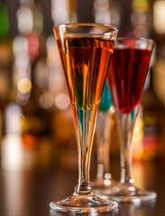 refreshing liqueur in a tall glass, alcoholic drink prepared by the bartender