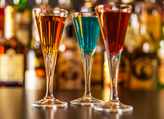 refreshing liqueur in a tall glass, alcoholic drink prepared by the bartender