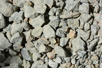 Beautiful graphite graphite stones of different sizes from large to small in the sun light