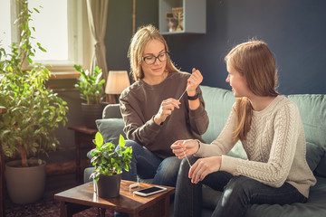 Periods. Menstrual cycle. Mother explains daughter the menstrual cycle and hygiene