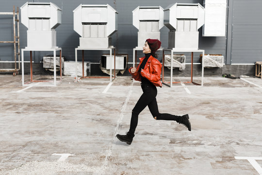 Real Teen Girl Outside Running On The Industrial Area