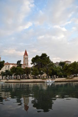 Fototapeta na wymiar Old church iconic bell tower in Trogir town centre, Trogir, Croatia, June, 2018