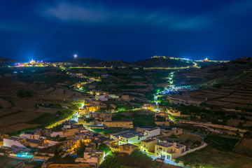 Aerial view of Victoria (Rabat) from the Il-Kastell citadel during night, Gozo, Malta