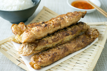 Penang Loh Bak is pork marinated in Chinese five spice powder, mixed with various ingredients, snugly rolled up with a sheet of bean curd and fried till crispy.