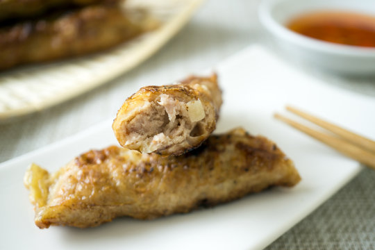 Penang Loh Bak is pork marinated in Chinese five spice powder, mixed with various ingredients, snugly rolled up with a sheet of bean curd and fried till crispy.