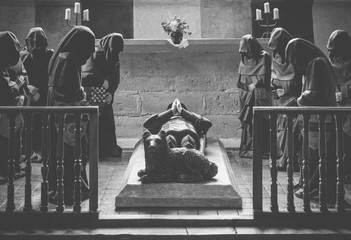 monks praying at funeral