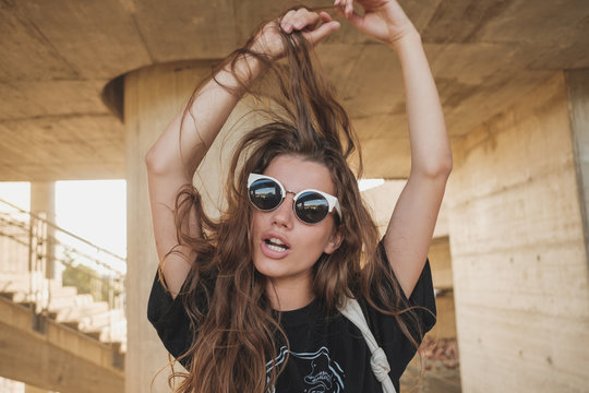 Portrait Of Young Hip Female Model With Messy Hair