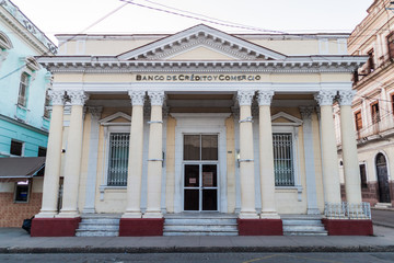 Fototapeta na wymiar CIENFUEGOS, CUBA - FEBRUARY 10, 2016: Building of Banco de Credito y Comercio bank in Cienfuegos, Cuba