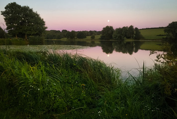 Lake with trees in the sunset