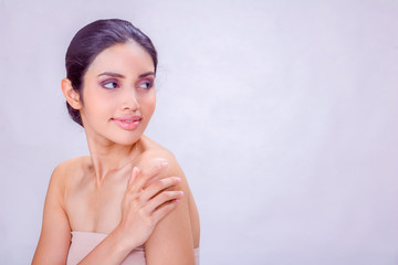 A young Asian woman portrait. She skin care image on white background . She is very happy and She smiles. Photo concept woman Portrait and skin care.