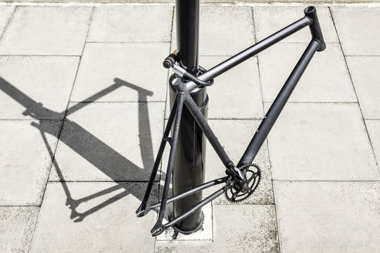 Bicycle frame locked to a post