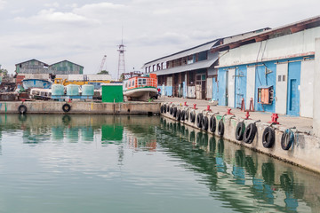 Fototapeta na wymiar Industrail buildings in a port of Cienfuegos, Cuba.