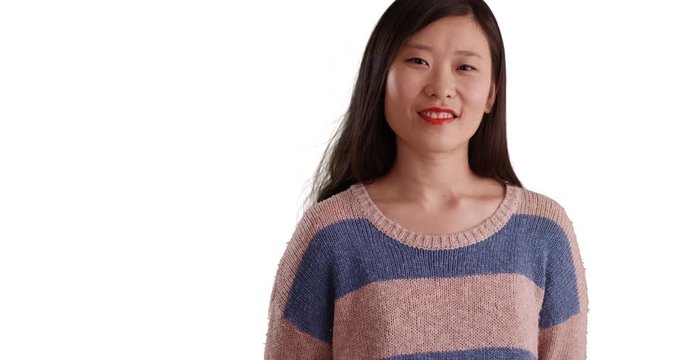 Happy millennial woman with big smile wearing a blue-striped sweater isolated on white background, Close up of young attractive Asian woman smiling for camera on copyspace, 4k