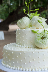Fototapeta na wymiar Wedding Cake with Flowers on Top