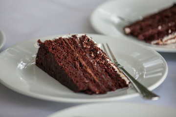 The wedding cake is cut  in wedding ceremony.


