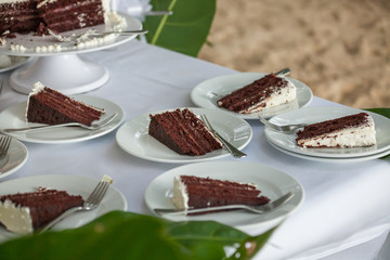 The wedding cake is cut  in wedding ceremony.

