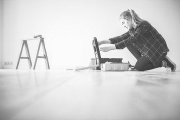 Young woman fixing in her home