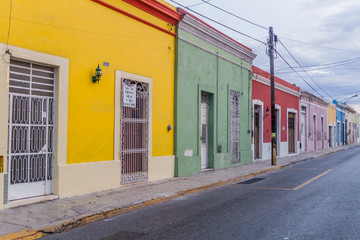 MERIDA, MEXICO - FEB 28, 2016: Colorful buildings lining the street in Merida.