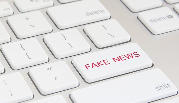 Close-up of a keyboard with the expression "Fake News". Concept Image.
