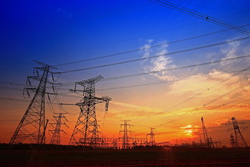 Fototapeta premium Electric tower, silhouette at sunset