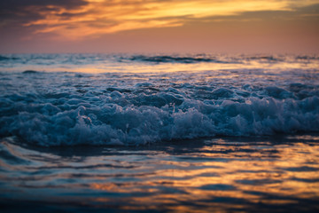Beautiful sunset reflected on the sea waves