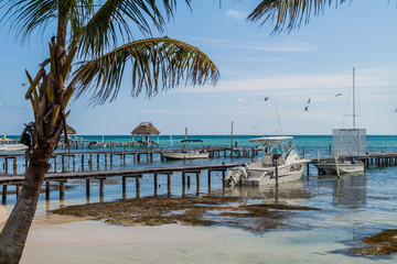 CAYE CAULKER, BELIZE - MARCH 2, 2016: View of piers in Caye Caulker village, Belize