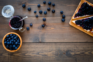 Bluberry toast for breakfast on dark wooden background top view space for text