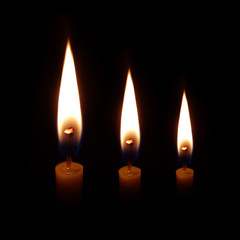  candle burning brightly in the black background