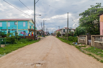 Fototapeta na wymiar Unpaved street in Dangriga town, Belize