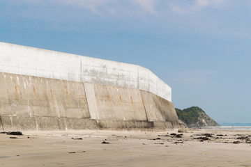 High concrete wall at seaside for protect tsunami big wave