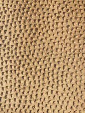 Architectural detail of building wall, small markings on stucco