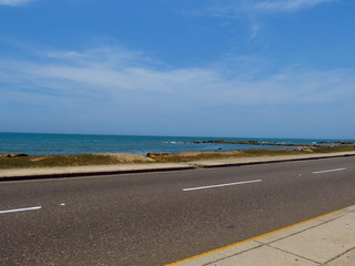 Panoramic view of the coastline of the city and the sea with blue sky with some boats or ships   